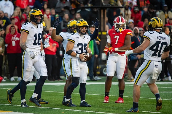 Colston Loveland (18), Caden Kolesar (35), and Christian Boivin (40)