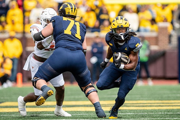 Evan Link (71) and Donovan Edwards (7)