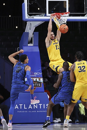 Olivier Nkamhoua (13) and Tarris Reed Jr. (32)