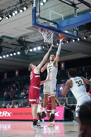 Olivier Nkamhoua (13) and Tarris Reed Jr. (32)
