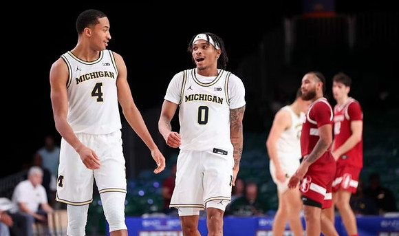Nimari Burnett (4) and Dug McDaniel (0)