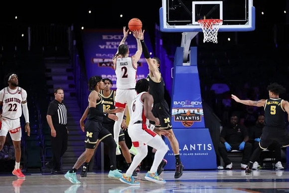 Dug McDaniel (0), Tarris Reed Jr. (32), and Olivier Nkamhoua (13)