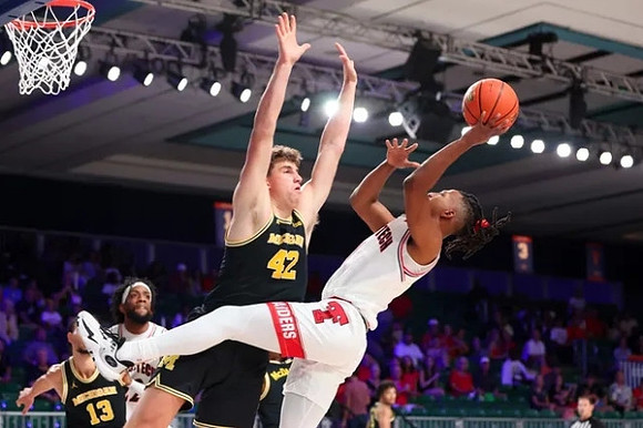 Olivier Nkamhoua (13) and Will Tschetter (42)