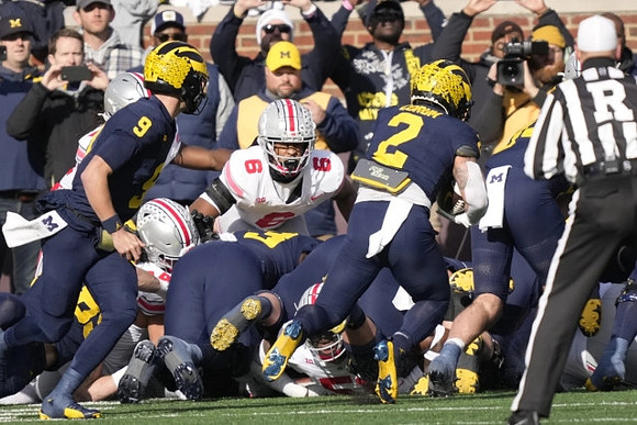 J.J. McCarthy (9) and Blake Corum (2)