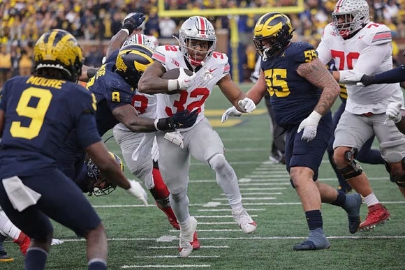 Rod Moore (9), Derrick Moore (8), and Mason Graham (55)