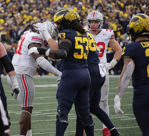 Trente Jones (53), AJ Barner (89), and Blake Corum (2)