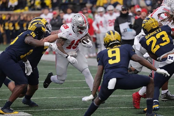 Ernest Hausmann (15), Rod Moore (9), and Michael Barrett (23)