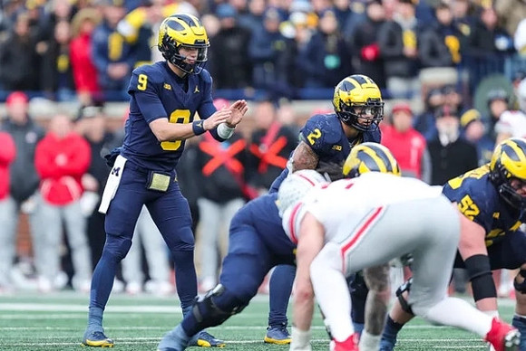 J.J. McCarthy (9), Blake Corum (2), and Karsen Barnhart (52)