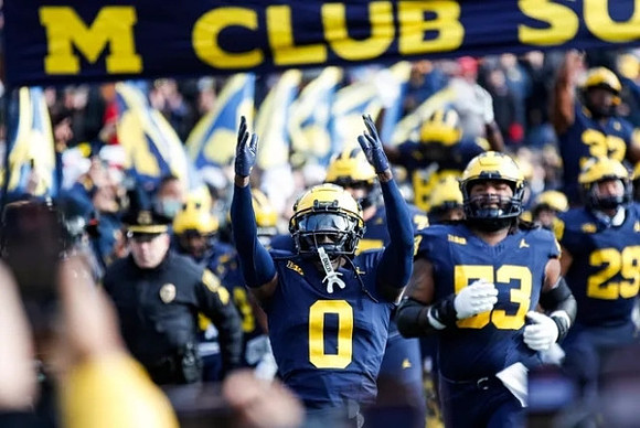 Mike Sainristil (0), Liam Groulx (53), and Joey Velazquez (29)
