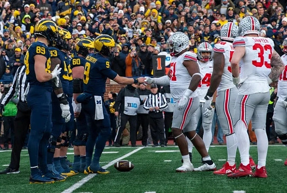 AJ Barner (89), Trente Jones (53), Drake Nugent (60), and J.J. McCarthy (9)
