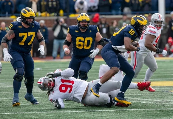 Trevor Keegan (77), Drake Nugent (60), and Alex Orji (10)