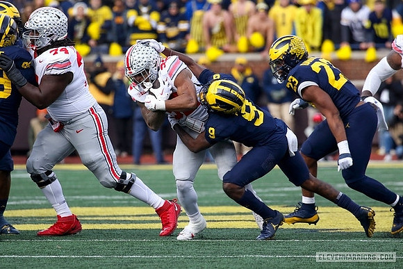 Cam Goode (99), Rod Moore (9), and Michael Barrett (23)
