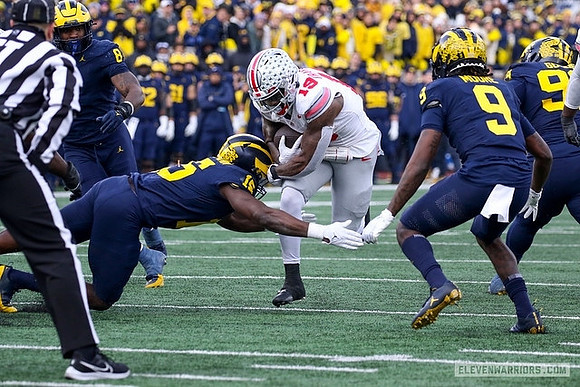 Derrick Moore (8), Ernest Hausmann (15), Rod Moore (9), and Cam Goode (99)