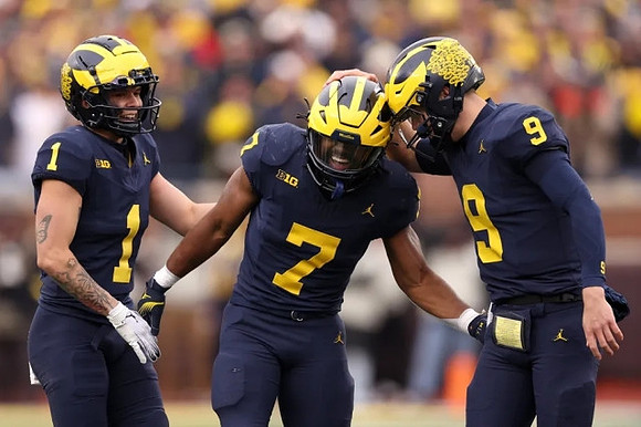 Roman Wilson (1), Donovan Edwards (7), and J.J. McCarthy (9)