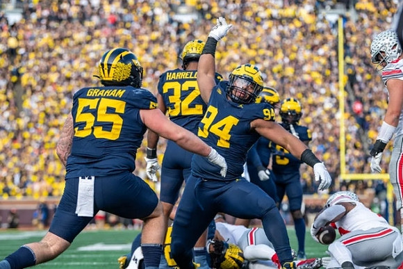 Mason Graham (55), Jaylen Harrell (32), and Kris Jenkins (94)