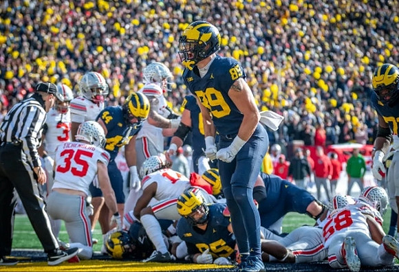 Max Bredeson (44), Blake Corum (2), Zak Zinter (65), and AJ Barner (89)