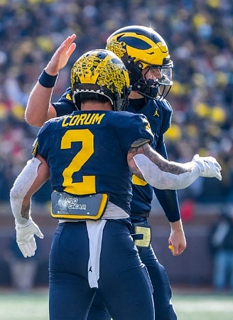 Blake Corum (2) and J.J. McCarthy (9)