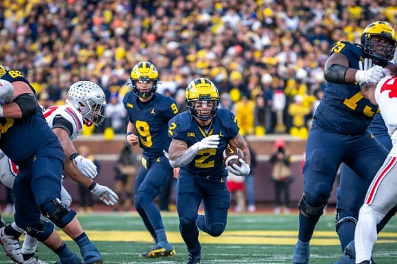 J.J. McCarthy (9), Blake Corum (2), and LaDarius Henderson (73)