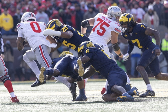 Junior Colson (25), Derrick Moore (8), and Makari Paige (7)