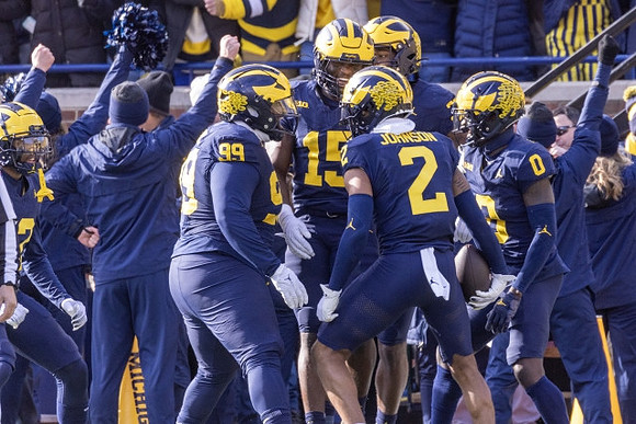Cam Goode (99), Ernest Hausmann (15), Will Johnson (2), and Mike Sainristil (0)