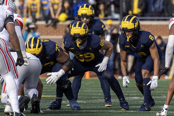 LaDarius Henderson (73), AJ Barner (89), Blake Corum (2), and Tyler Morris (8)