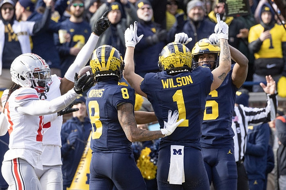 Tyler Morris (8), Roman Wilson (1), and Cornelius Johnson (6)