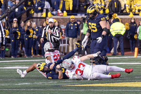 J.J. McCarthy (9), Karsen Barnhart (52), and Zak Zinter (65)