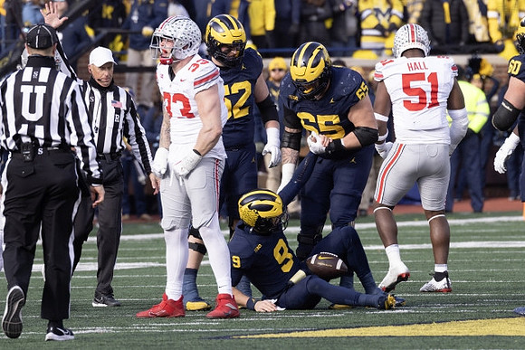 J.J. McCarthy (9), Karsen Barnhart (52), and Zak Zinter (65)
