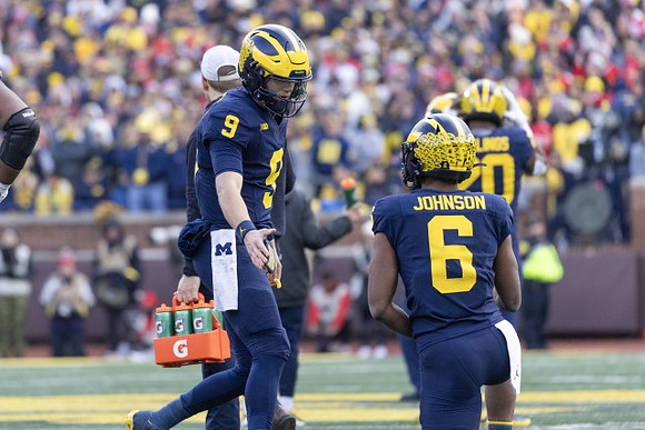 J.J. McCarthy (9), Cornelius Johnson (6), and Kalel Mullings (20)