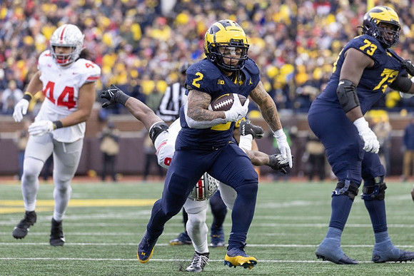 Blake Corum (2) and LaDarius Henderson (73)