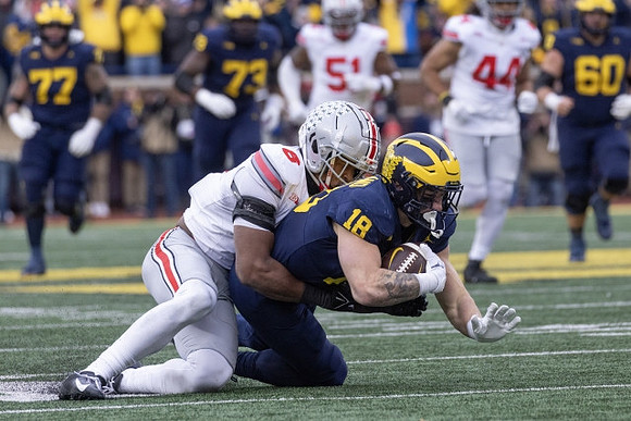 Colston Loveland (18), Trevor Keegan (77), LaDarius Henderson (73), and Drake Nugent (60)