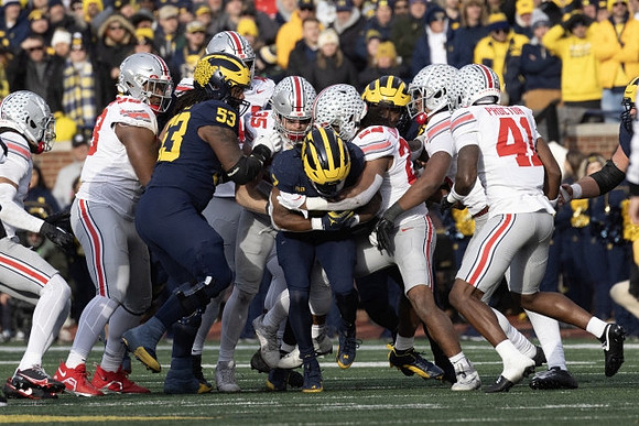 Trente Jones (53) and Donovan Edwards (7)