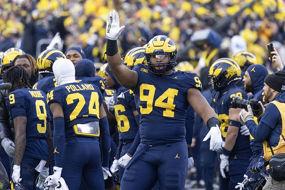 Kris Jenkins (94) and Michigan Team