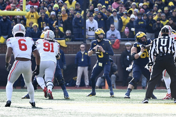J.J. McCarthy (9) and Drake Nugent (60)