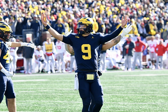 Max Bredeson (44) and J.J. McCarthy (9)