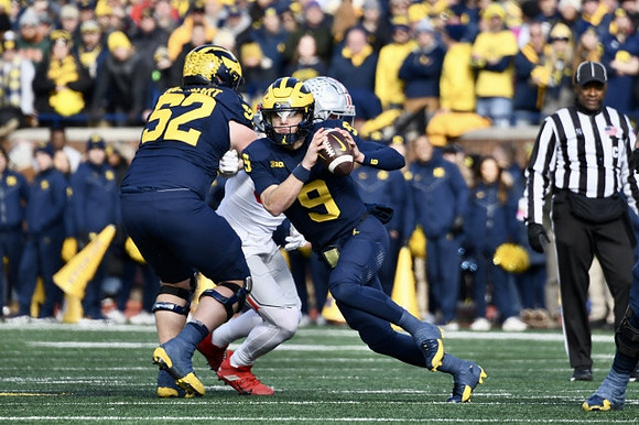Karsen Barnhart (52) and J.J. McCarthy (9)