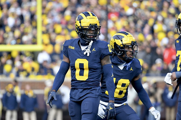Mike Sainristil (0) and Ja'Den McBurrows (18)