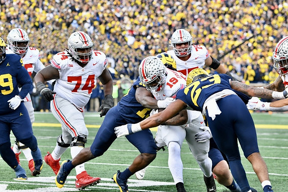 Cam Goode (99), Ernest Hausmann (15), and Michael Barrett (23)