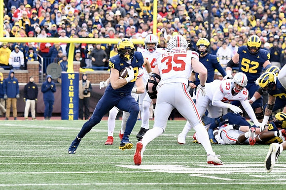 AJ Barner (89), J.J. McCarthy (9), Karsen Barnhart (52), and Zak Zinter (65)