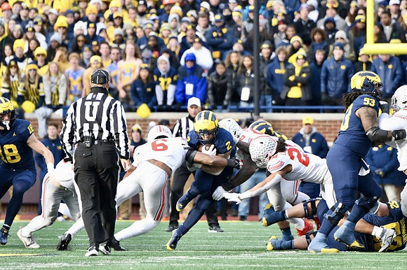 Colston Loveland (18), Blake Corum (2), Trente Jones (53), and Karsen Barnhart (52)