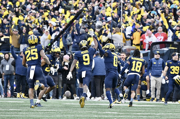 Junior Colson (25), Michael Barrett (23), Rod Moore (9), Mike Sainristil (0), and Ja'Den McBurrows (18)
