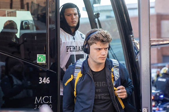 Blake Corum (2) and J.J. McCarthy (9)