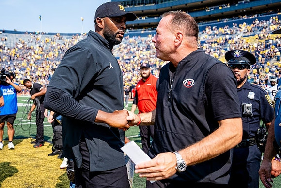 Sherrone Moore and Arkanas State Head Coach Butch Jones