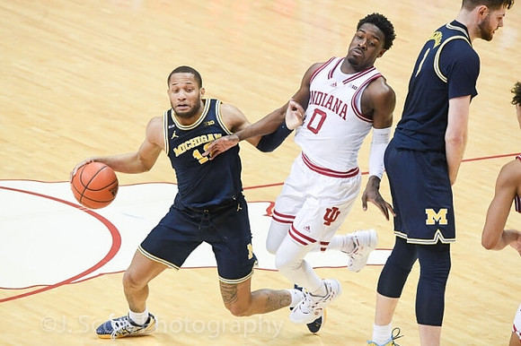 DeVante' Jones (12) and Hunter Dickinson (1)