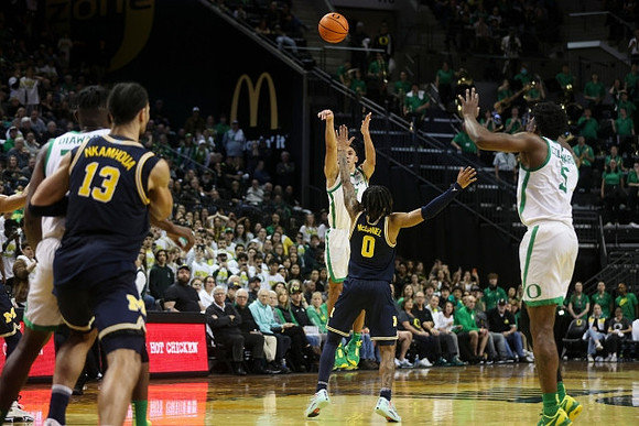 Olivier Nkamhoua (13) and Dug McDaniel (0)