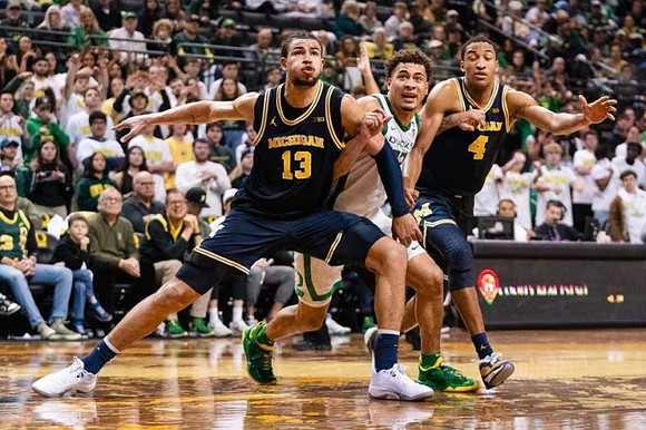 Olivier Nkamhoua (13) and Nimari Burnett (4)