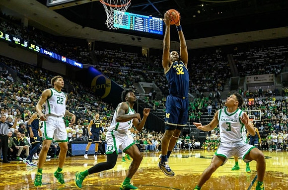 Tarris Reed Jr. (32) and Olivier Nkamhoua (13)
