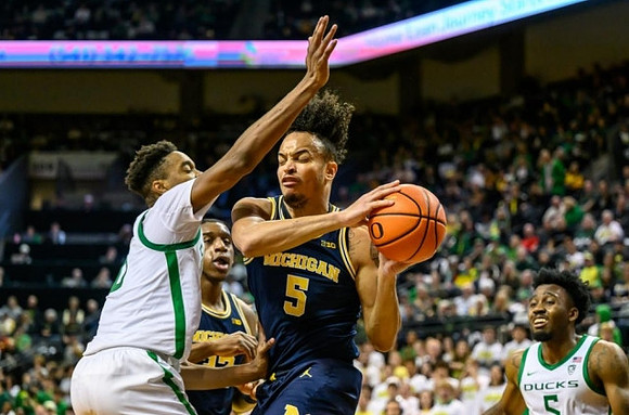 Tarris Reed Jr. (32) and Terrance Williams II (5)