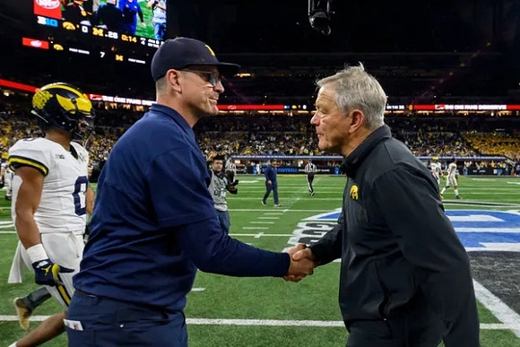 Darrius Clemons (0), Jim Harbaugh, and Iowa Head Coach Kirk Ferentz