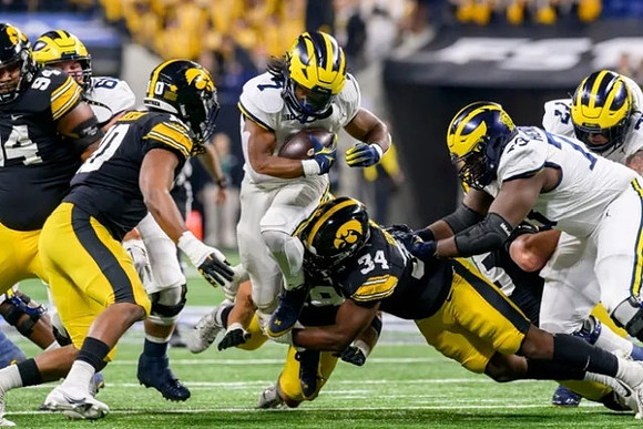 Drake Nugent (60), Donovan Edwards (7), and LaDarius Henderson (73)